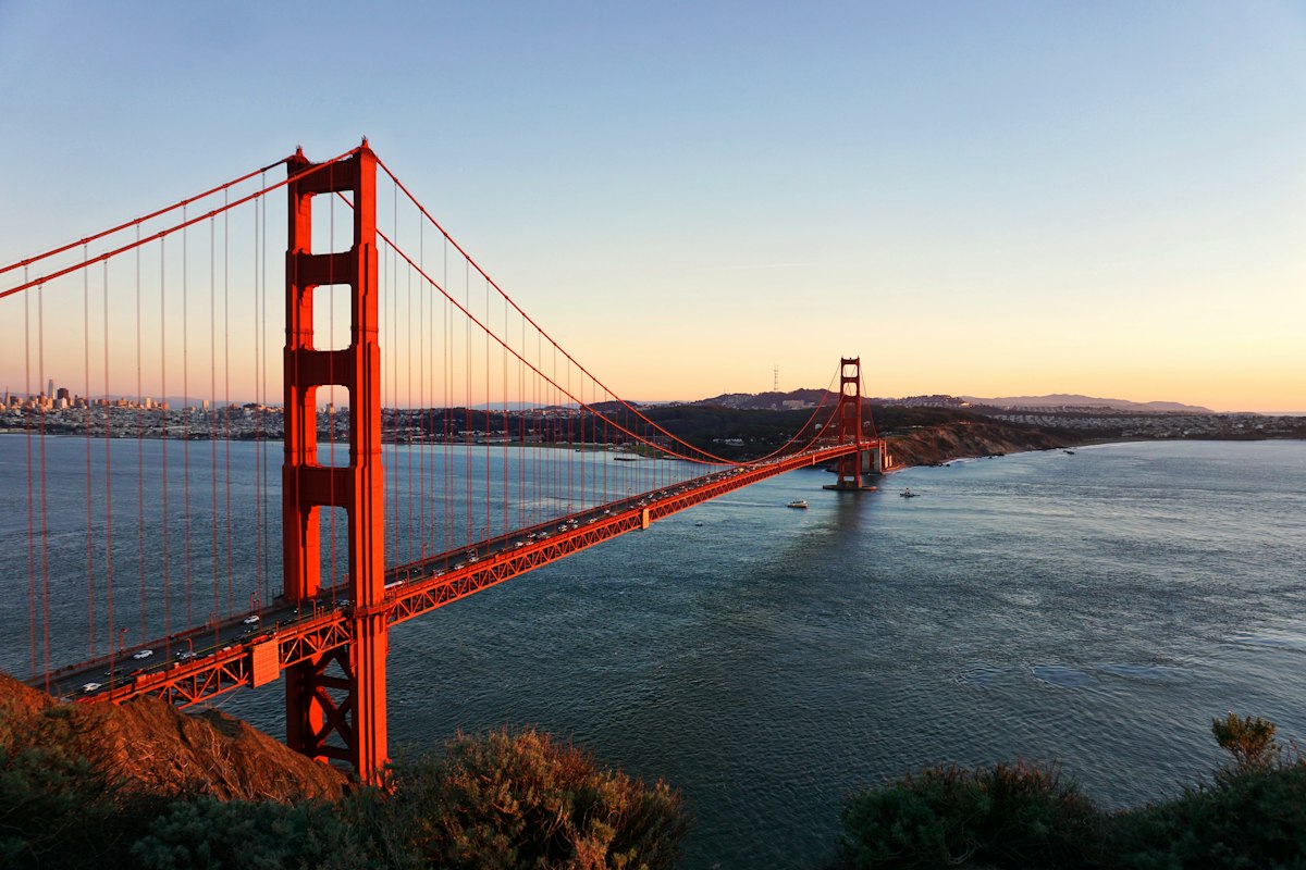 The Golden Gate Bridge at sunset seen from the Marin Headlands, with San Francisco behind it