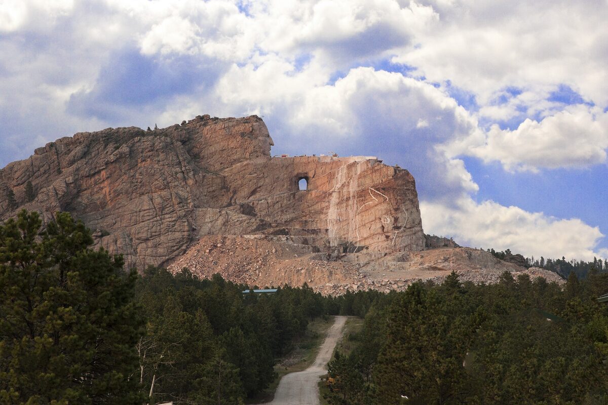 Crazy Horse Memorial, the carved mountain in the Black Hills, with the finished face and the outstretched arm still rough rock