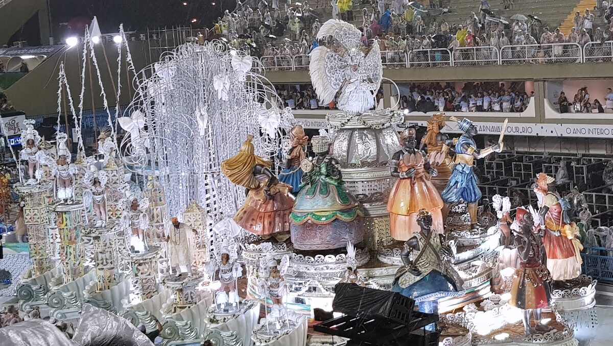 A silver samba school float passing the grandstands of the Sambadrome in Rio