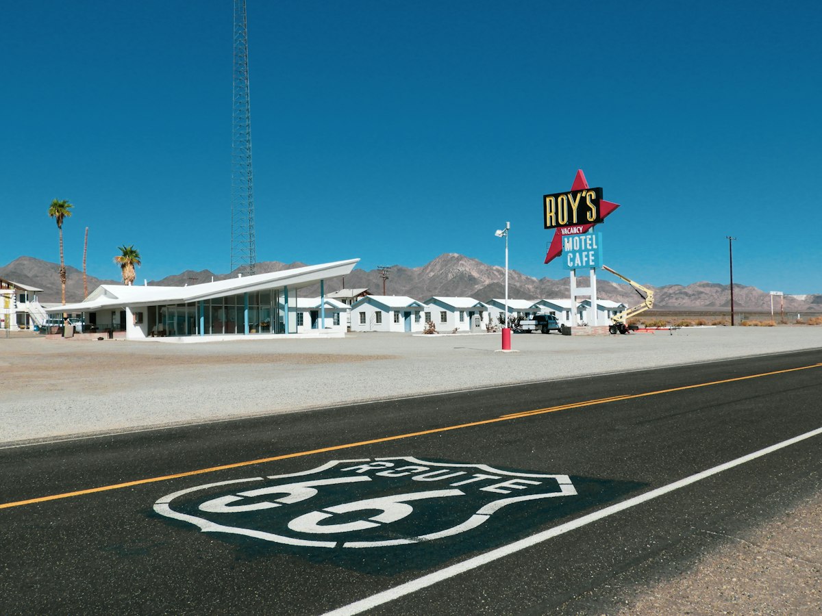 Route 66 shield painted on the road in front of Roy's Motel and Cafe in Amboy, California