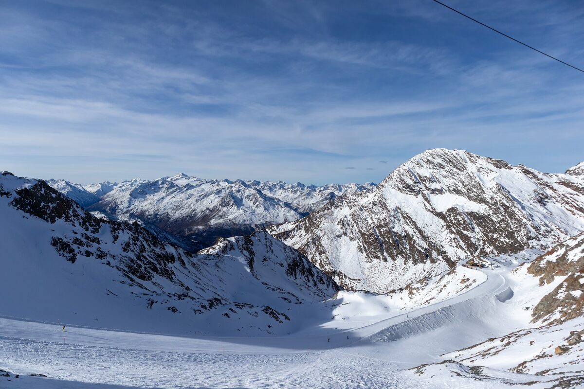 A wide glacier slope on the Stubai Glacier with snowy Tyrolean peaks behind