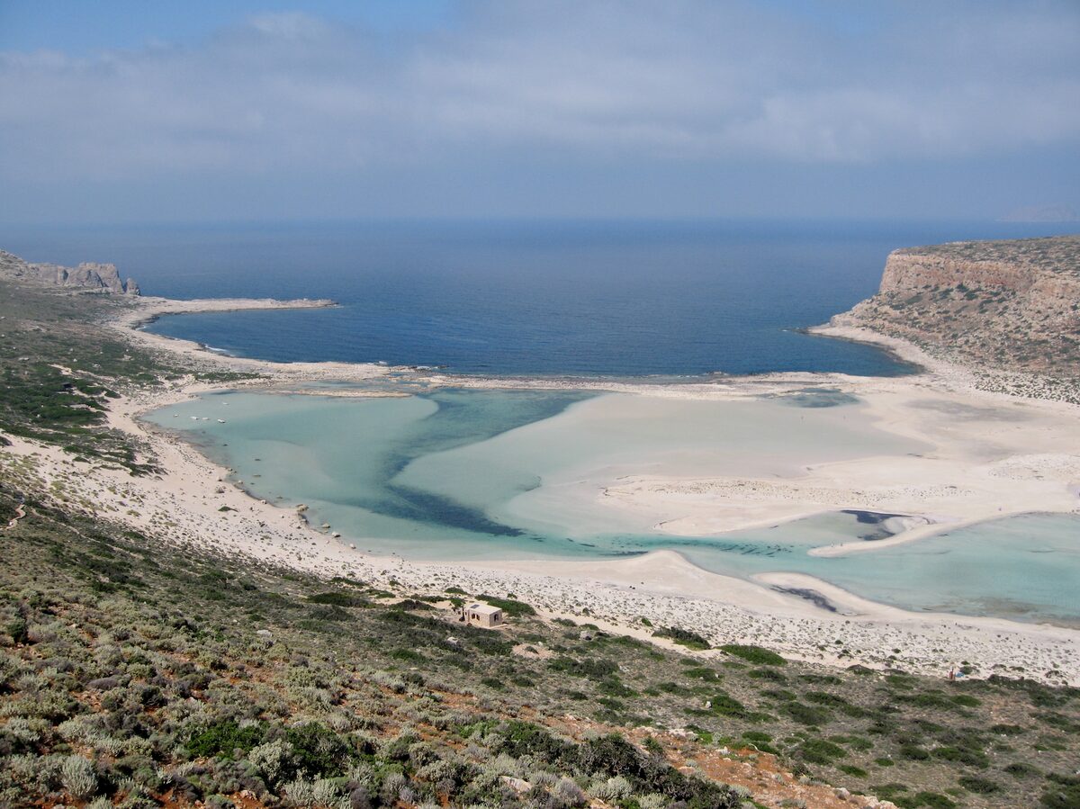 The Balos lagoon on the Gramvousa peninsula, white sand and pale turquoise water between rocky hills