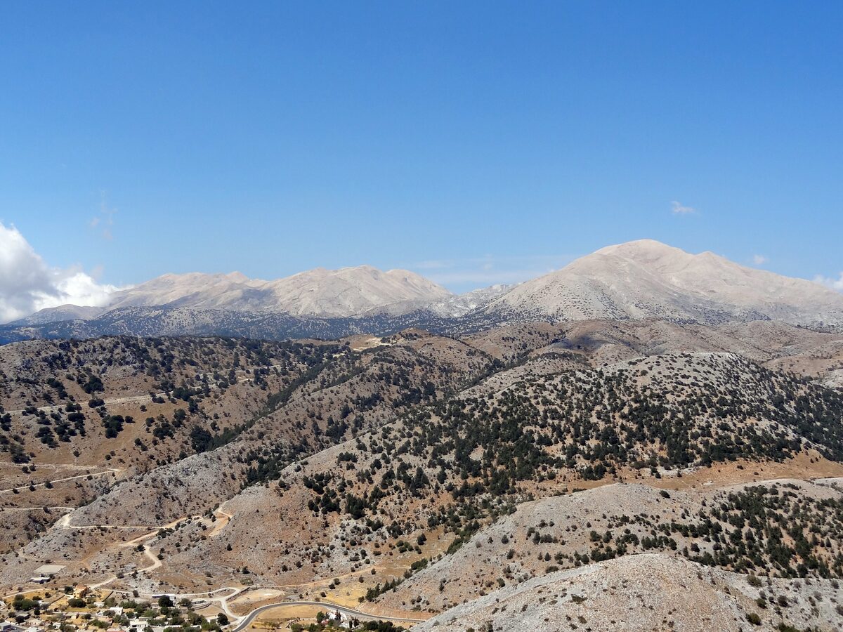 The pale limestone summits of the White Mountains (Lefka Ori) above dry, scrubby hills in western Crete