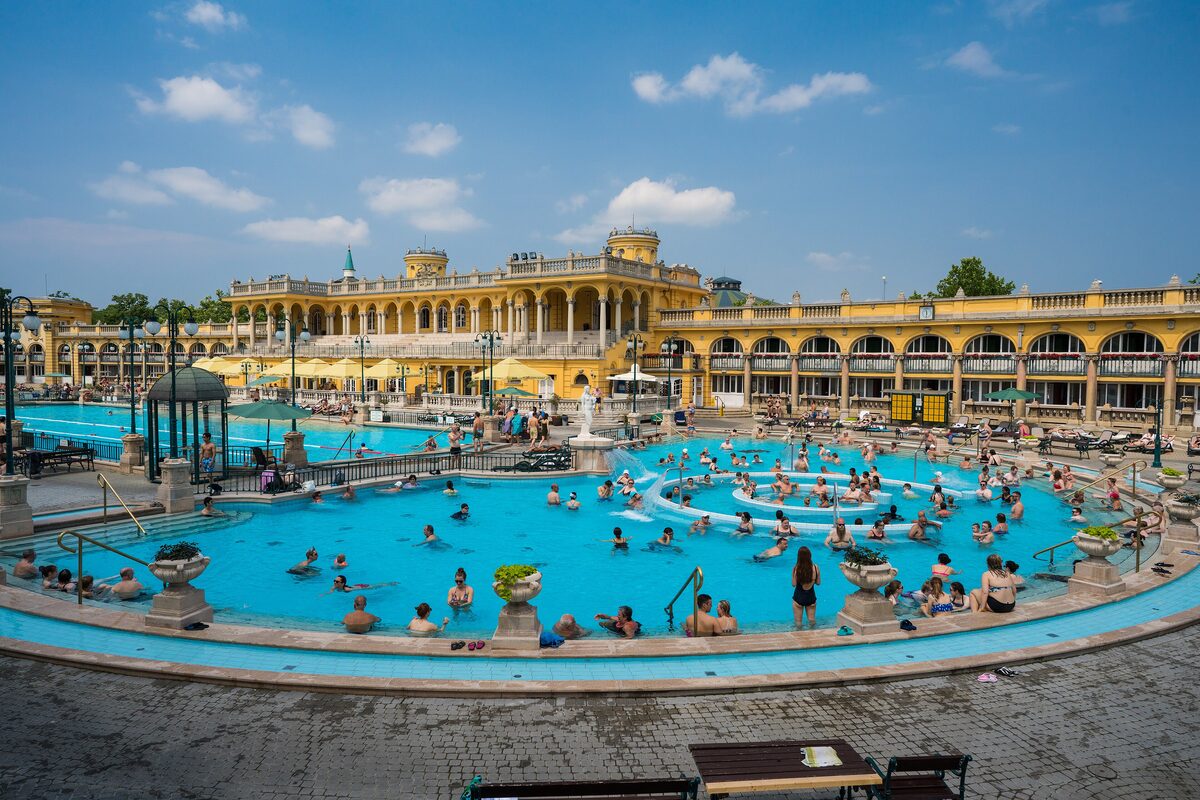 The yellow Neo-Baroque buildings and outdoor thermal pools of the Szechenyi Baths in Budapest