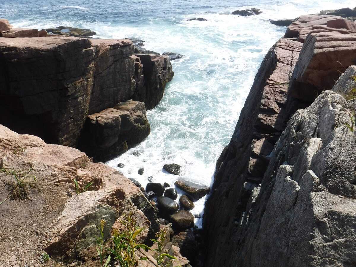 Waves surging into the narrow granite chasm of Thunder Hole