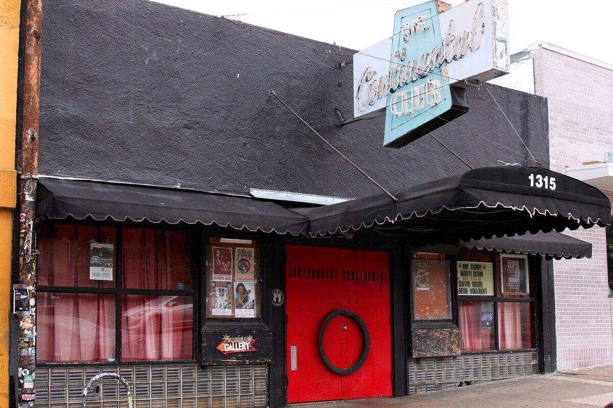 The Continental Club on South Congress Avenue with its red door, neon sign and black awning