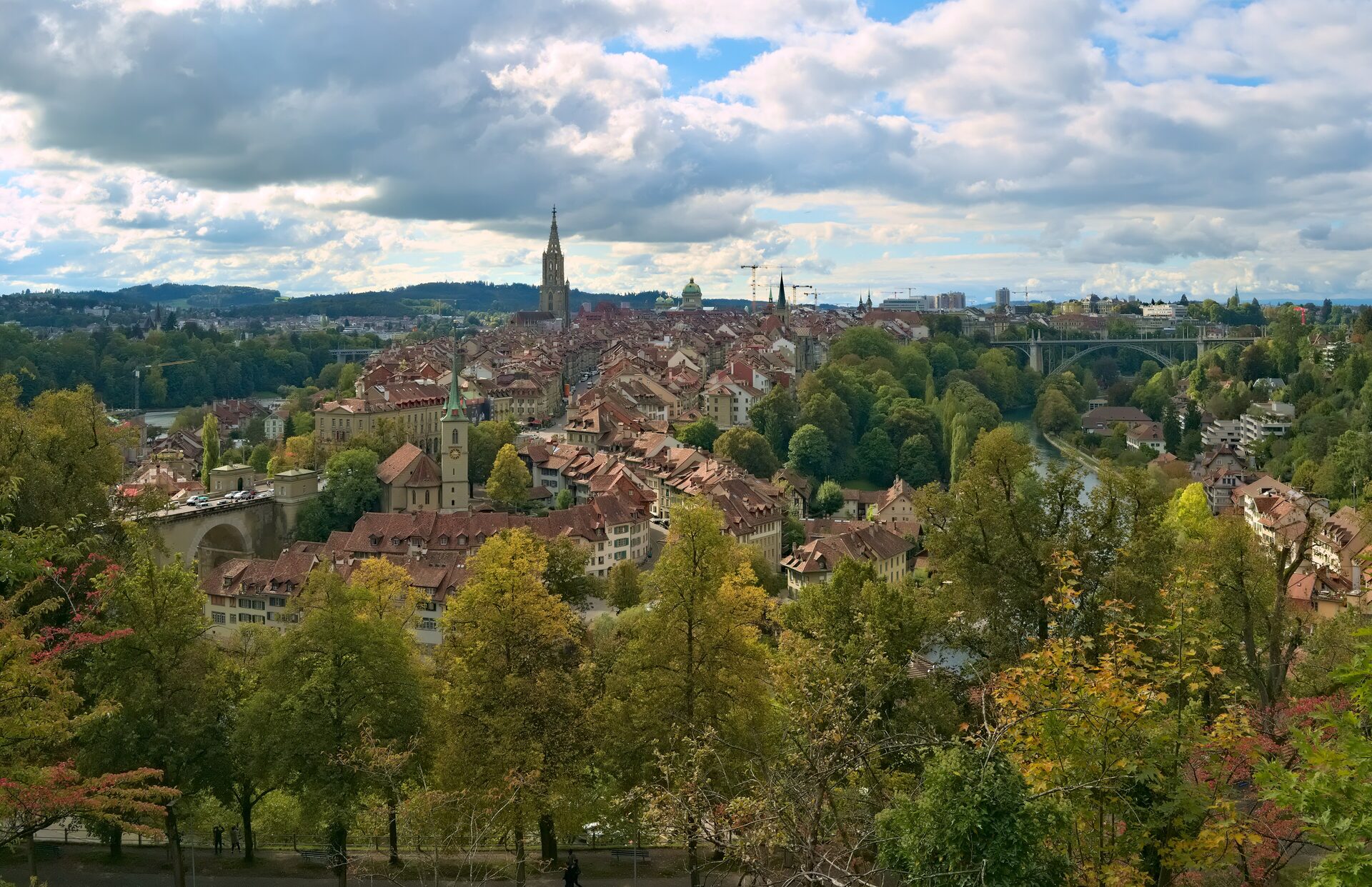 The old town of Bern on its peninsula in a bend of the Aare, with the Minster tower rising above red roofs
