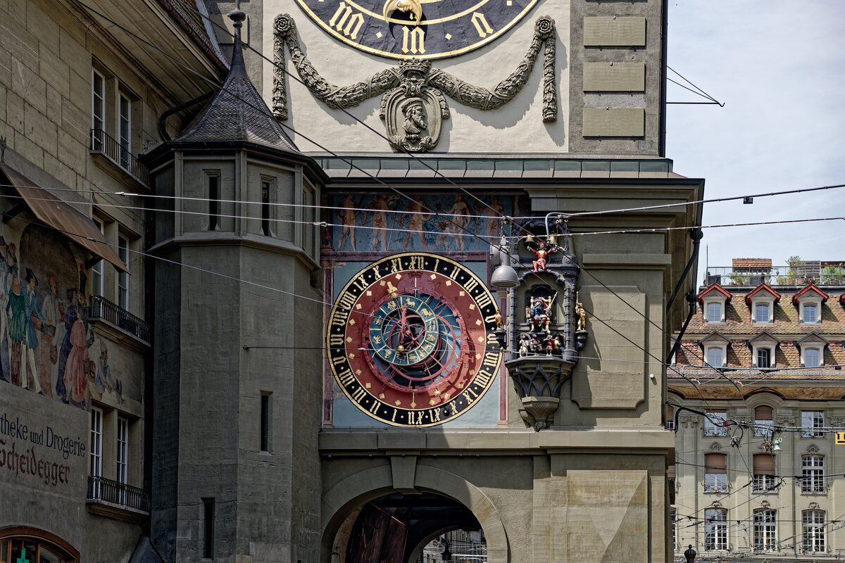 The astronomical clock face of the Zytglogge tower, with its gilded hands and painted dial