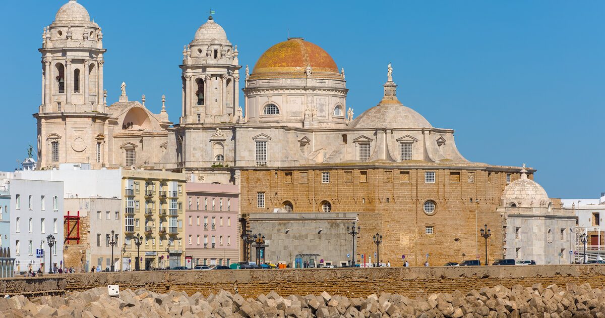 Cádiz Cathedral's yellow dome above the seafront, in sunshine