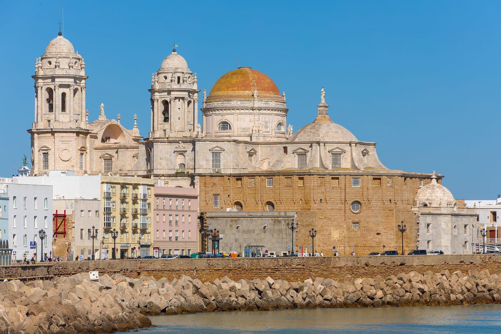 Cádiz Cathedral's yellow dome above the seafront, in sunshine