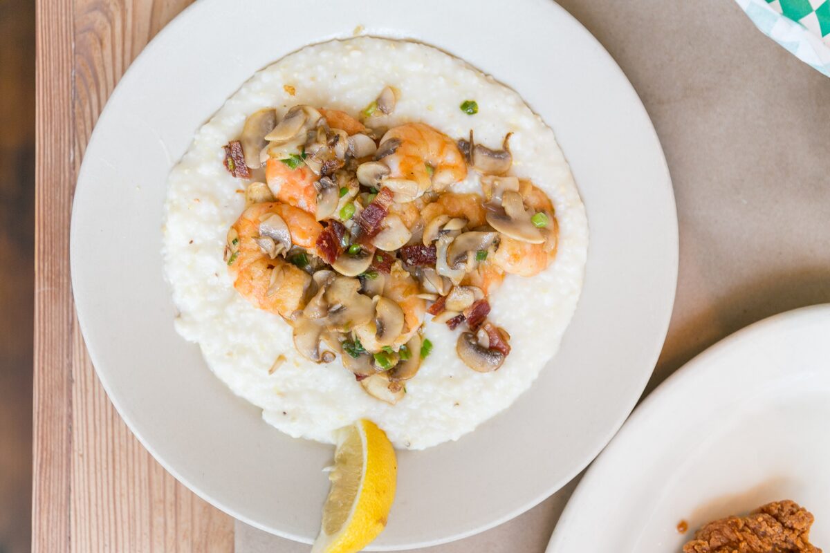 Shrimp with mushrooms and bacon over creamy grits, Charleston style