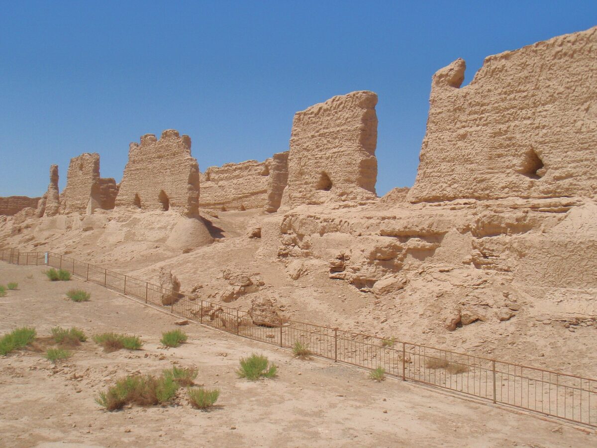 Weathered rammed-earth walls of the Han-era Hecang granary ruins in the desert