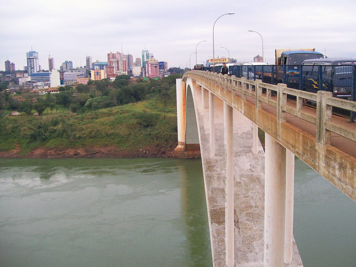 The Friendship Bridge over the Paraná river, with the Ciudad del Este skyline on the far bank