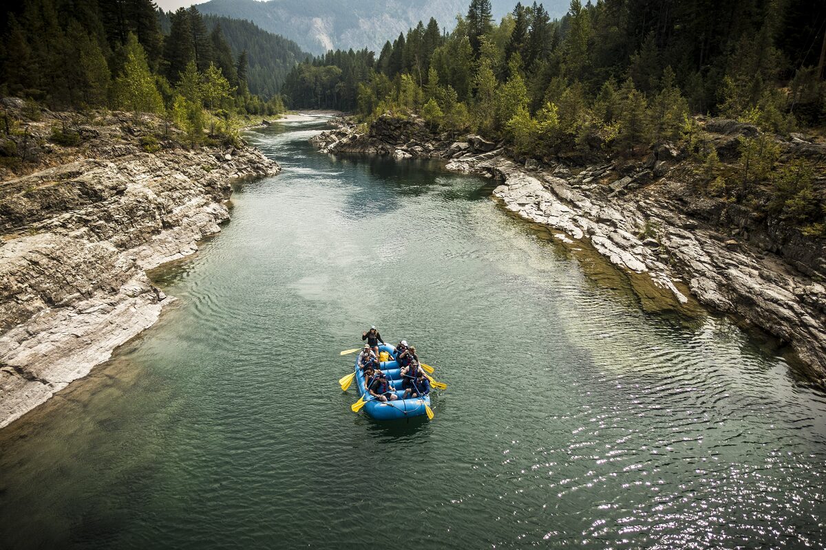 A raft on the green Middle Fork of the Flathead River