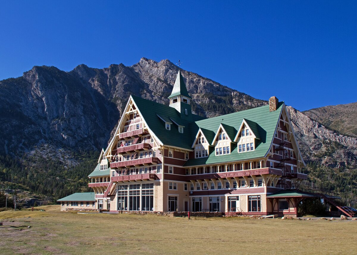 Prince of Wales Hotel with mountains behind in Waterton