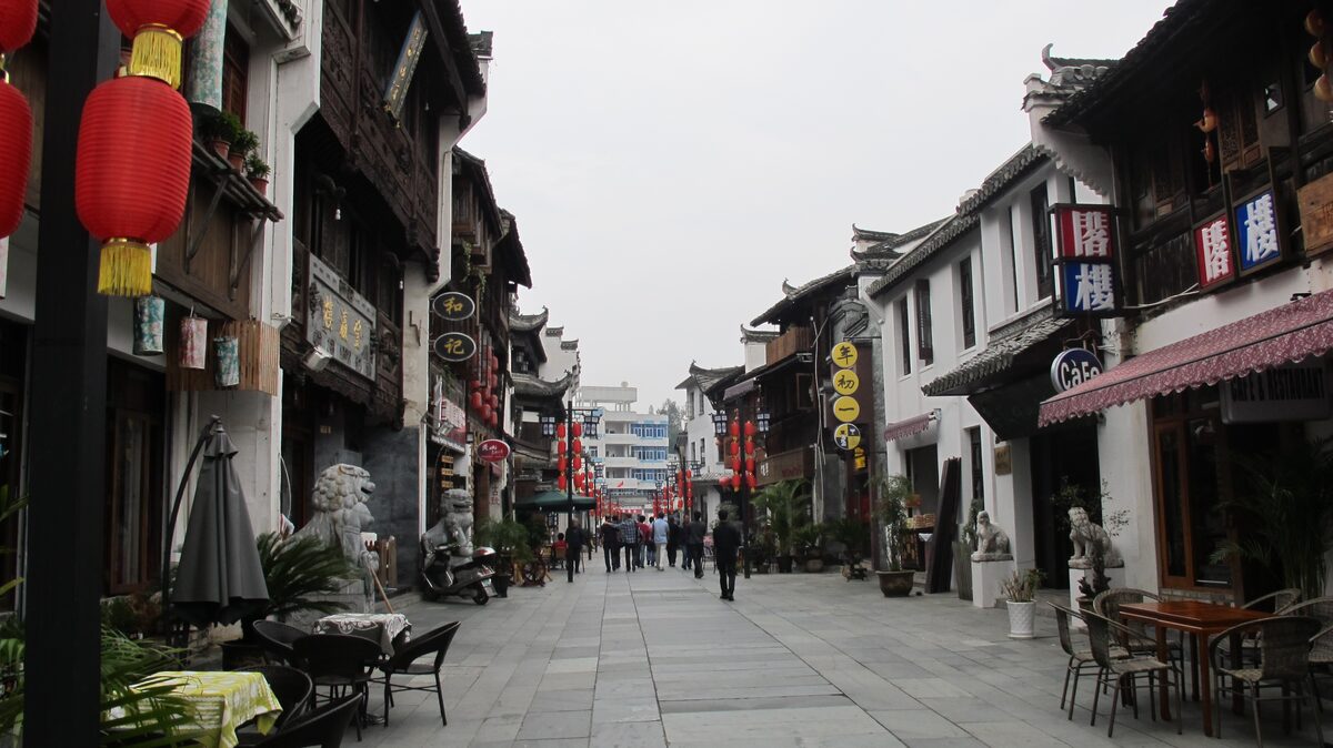Tunxi Old Street, a paved pedestrian lane lined with Huizhou-style shops and red lanterns