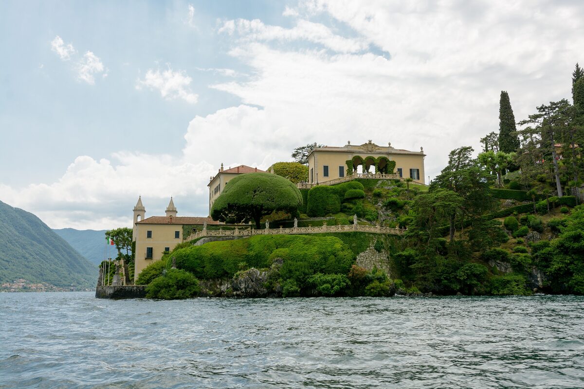 Villa del Balbianello on its wooded point, seen from the water