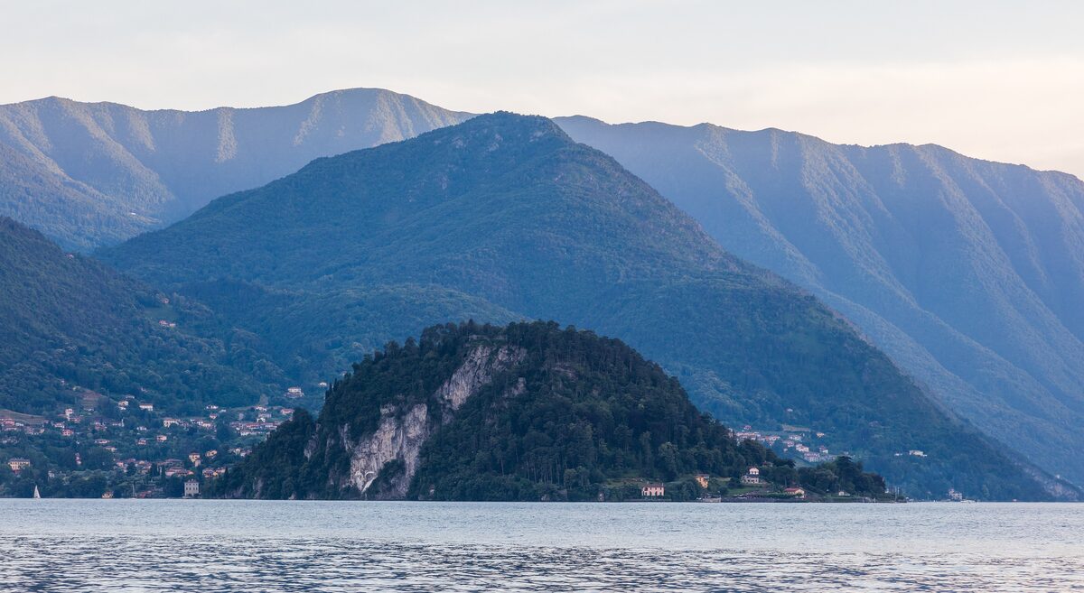 The wooded Bellagio promontory above the lake, with layered mountains behind