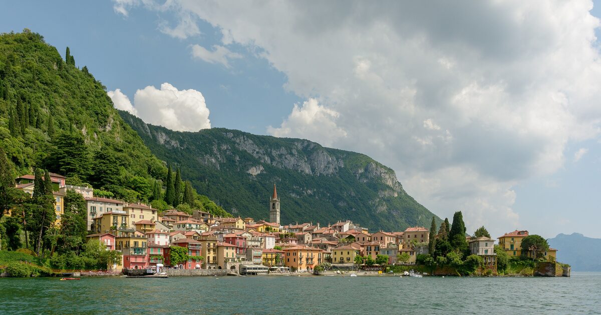 Lake Como with the village of Varenna on the shore and mountains rising behind the water