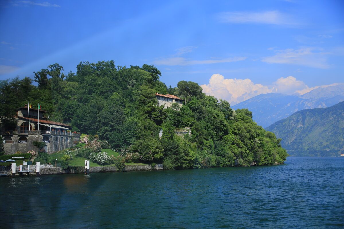 Isola Comacina, a wooded island with a house on its shore