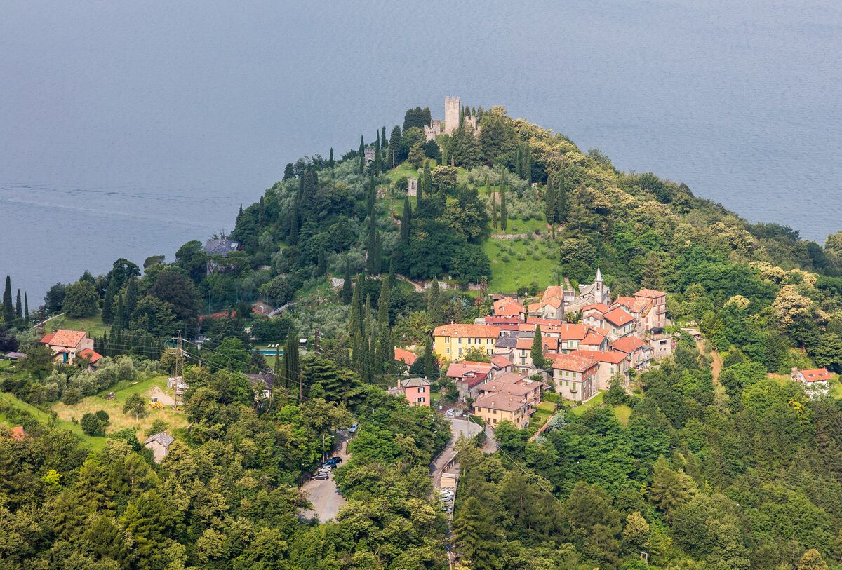 Vezio castle on its wooded hill above the village