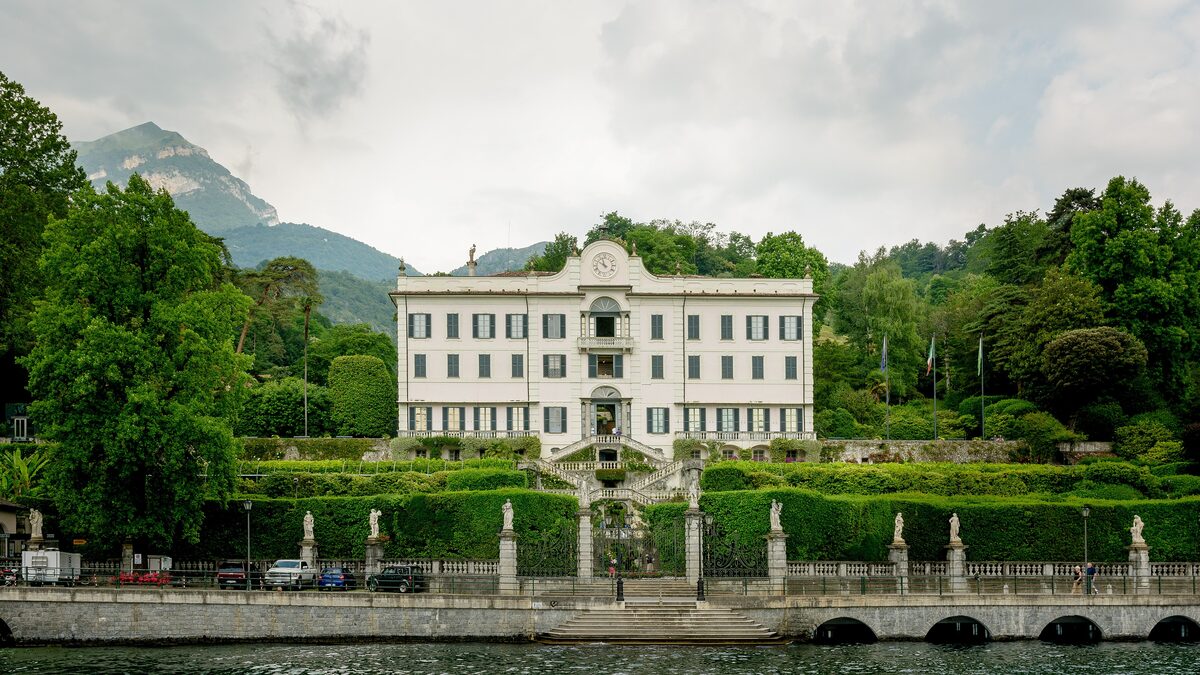 The pale facade of Villa Carlotta above its formal garden terraces