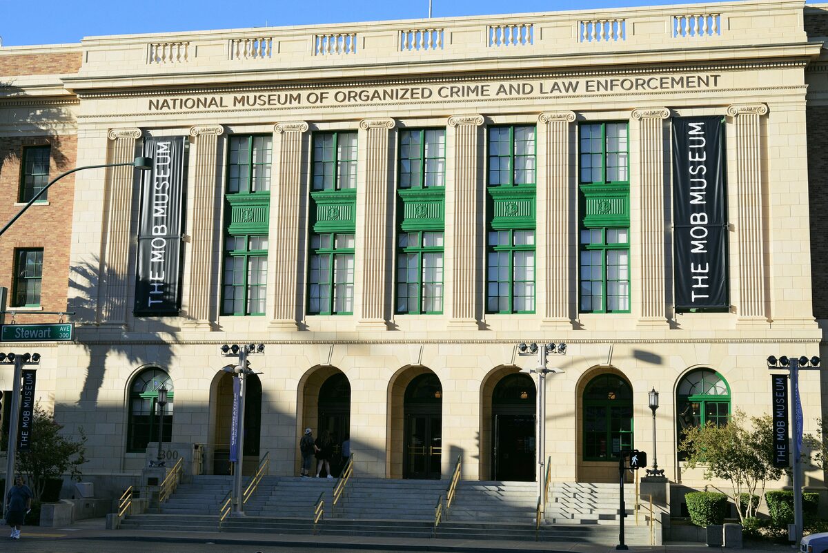 The neoclassical front of the former federal courthouse that houses The Mob Museum, with banners between the columns