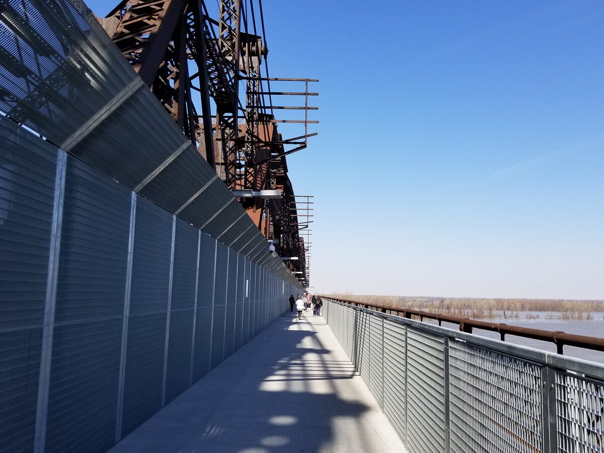 The walking path on the Harahan Bridge beside old railway steelwork