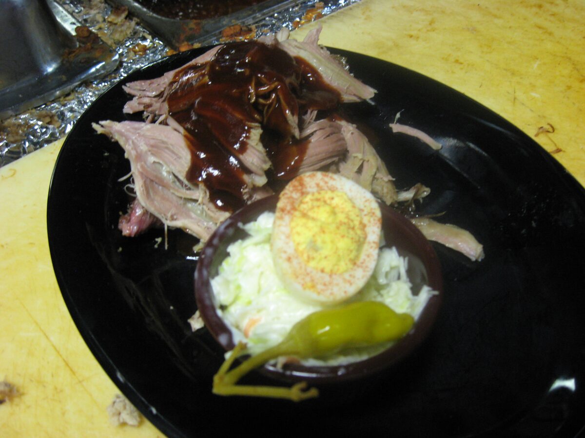 Pulled pork with sauce, slaw and a deviled egg