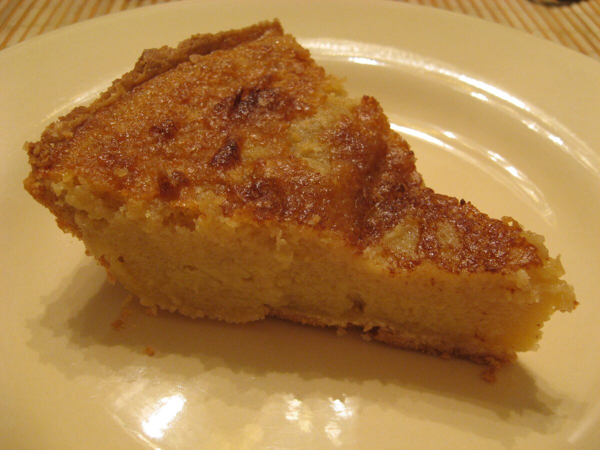 A slice of buttermilk chess pie on a plate