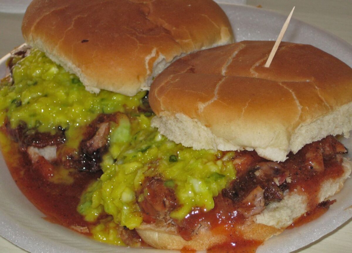 A chopped pork sandwich with slaw and sauce at Payne's