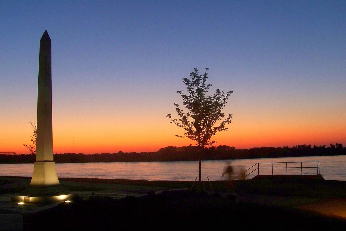 The Tom Lee obelisk by the Mississippi at sunset