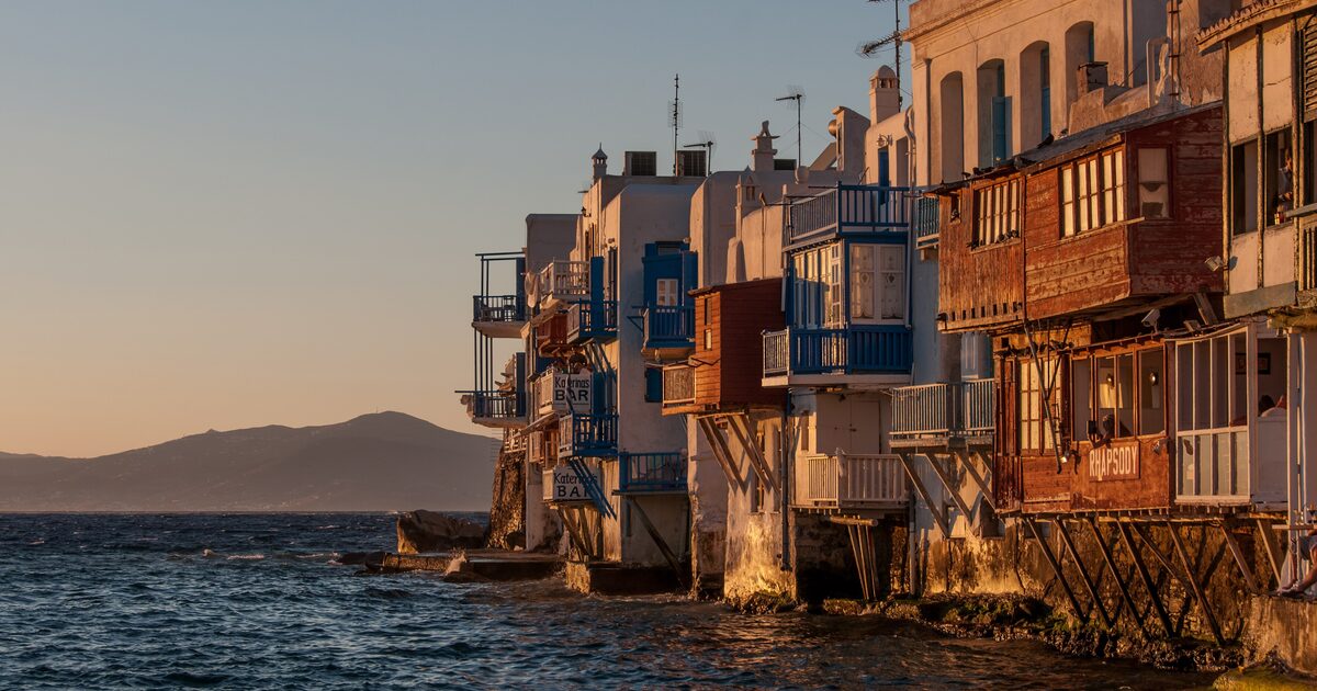 Little Venice at sunset, its waterfront houses on stilts above the sea
