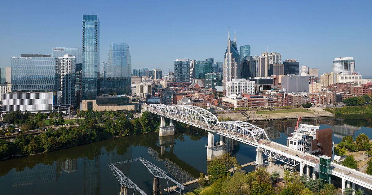 The Nashville skyline on the Cumberland River with the John Seigenthaler Pedestrian Bridge in the foreground