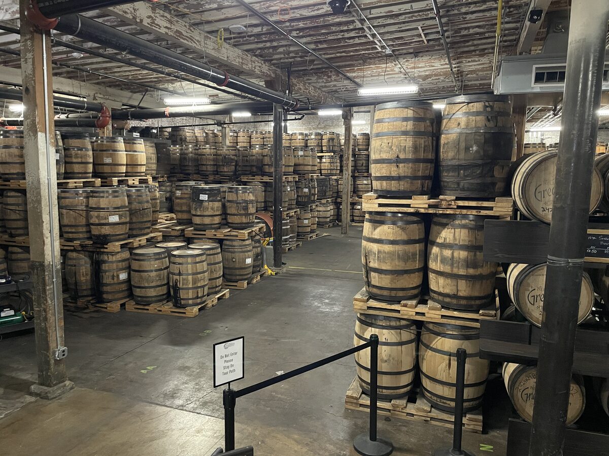 Whiskey barrels stacked on pallets in a Nelson's Green Brier aging warehouse