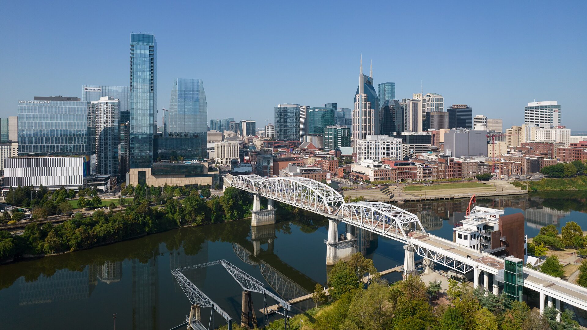 The Nashville skyline on the Cumberland River with the John Seigenthaler Pedestrian Bridge in the foreground