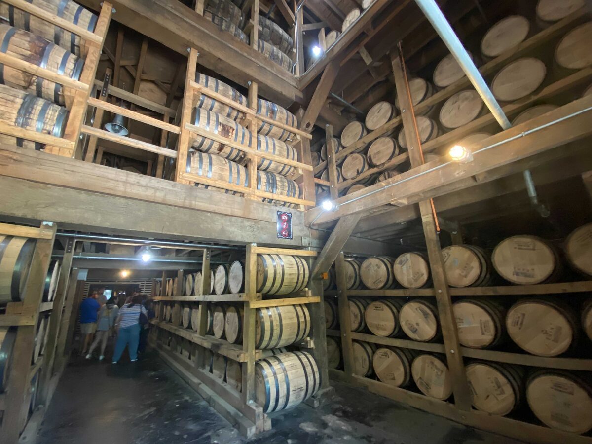 Wooden barrels stacked in racks inside a Jack Daniel's barrelhouse