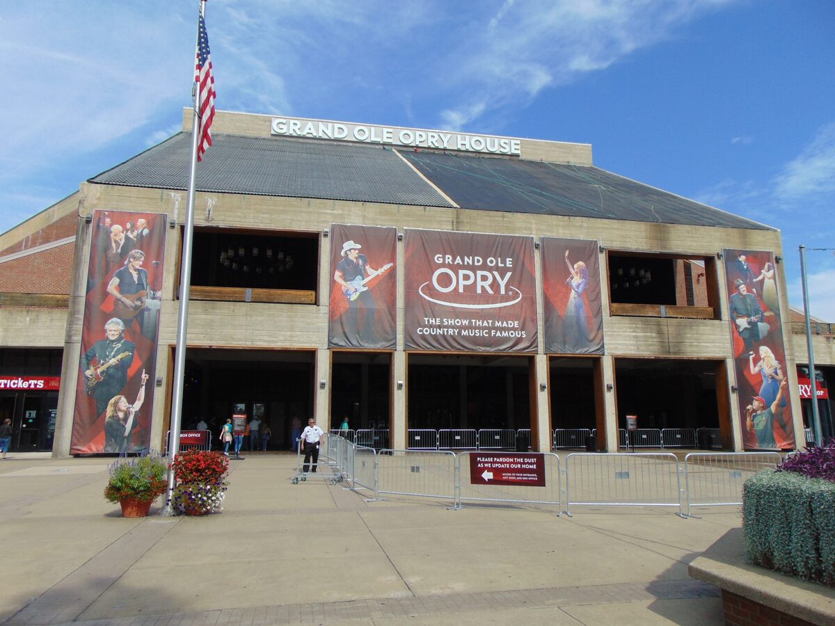 The front of the Grand Ole Opry House with show banners hanging above the entrance