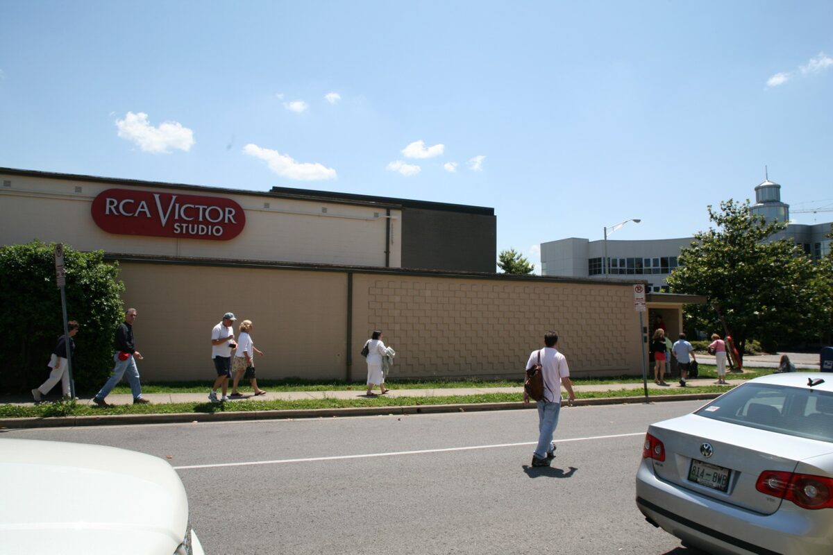 The low RCA Victor Studio building with its red sign and visitors walking past