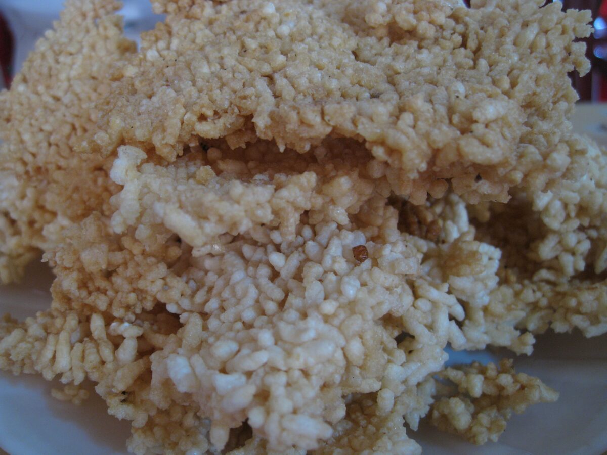 Golden-brown crispy rice crusts piled on a plate