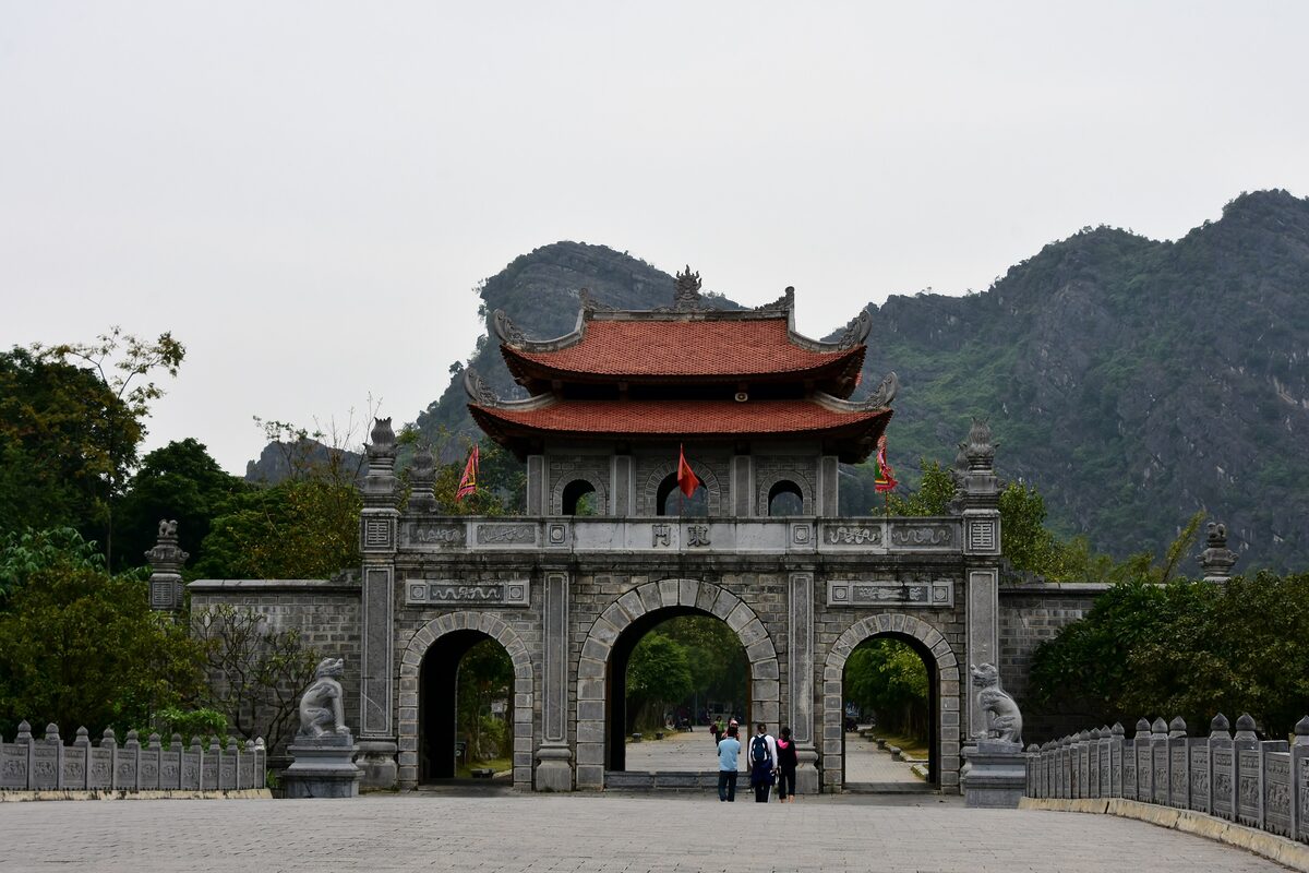 The gate of the Temple of Emperor Dinh Tien Hoang at Hoa Lu, with a karst hill behind it