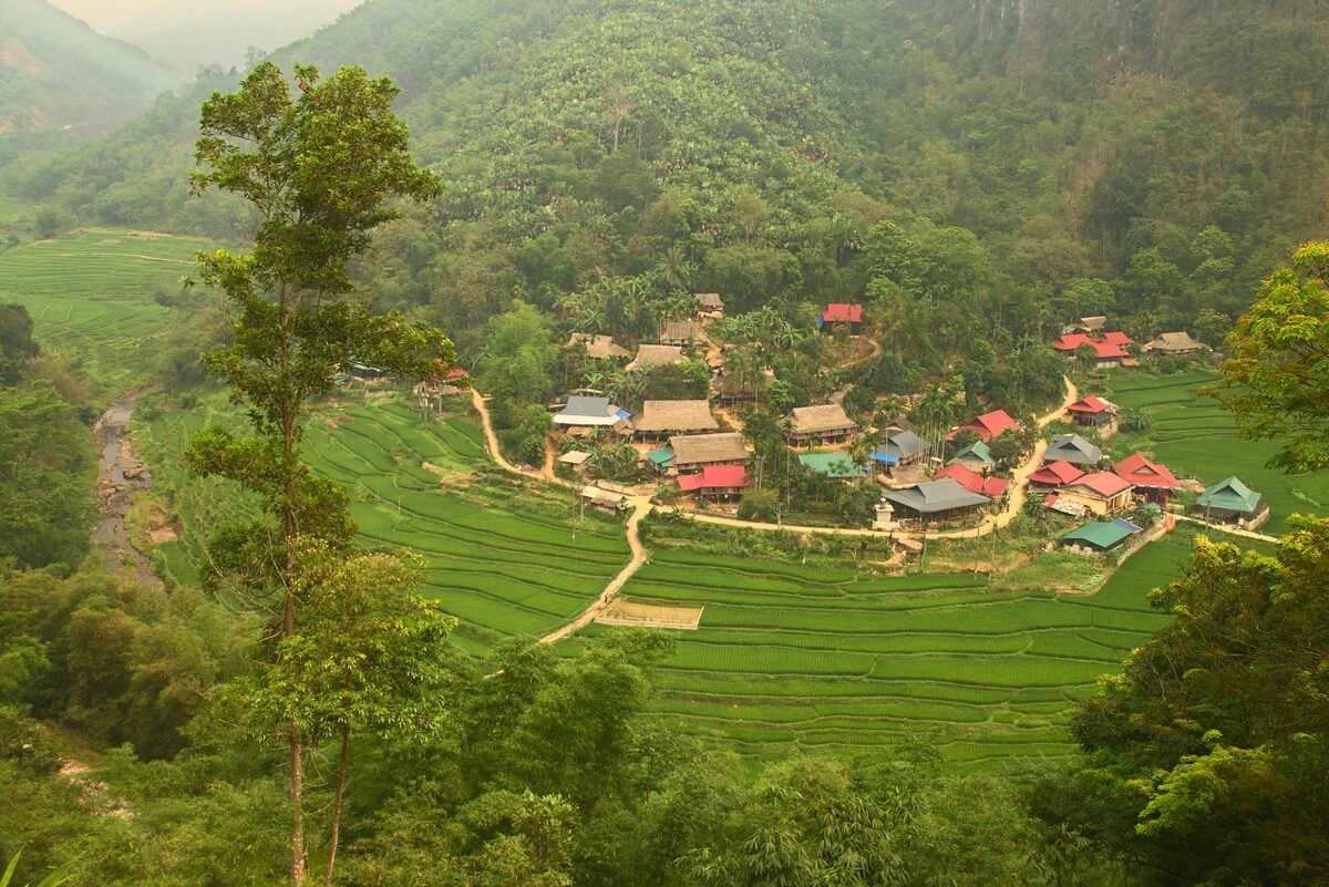 Terraced fields and a village of houses on the hillside of Pu Luong nature reserve