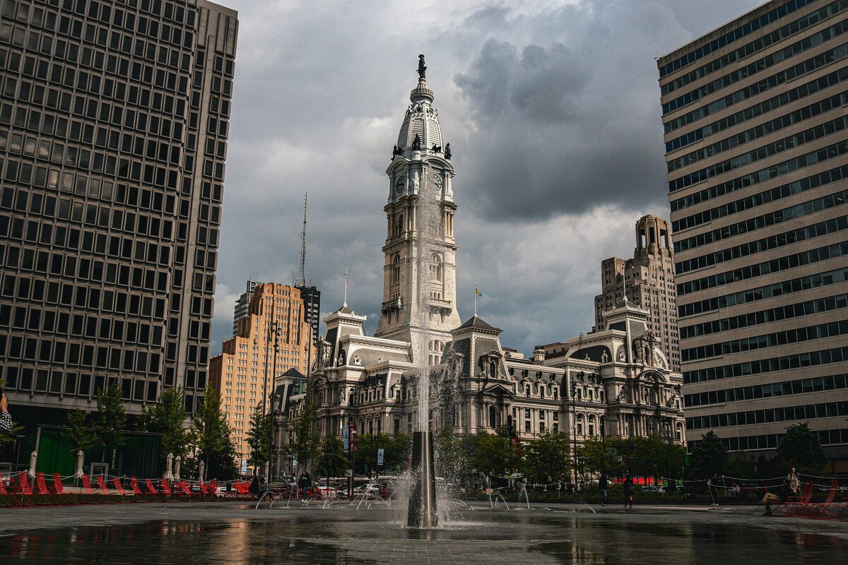 City Hall's clock tower rising behind the fountain in LOVE Park