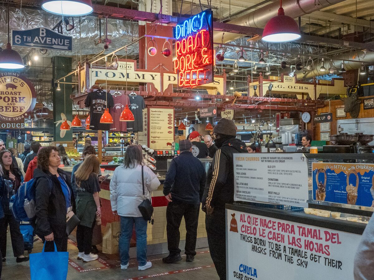 DiNic's Roast Pork and Beef stand and its neon sign at Reading Terminal