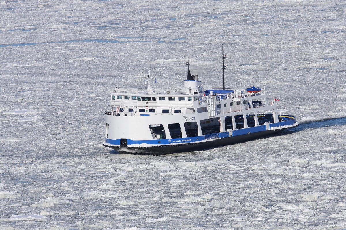 The Québec-Lévis ferry Alphonse-Desjardins crossing the St. Lawrence through floating ice