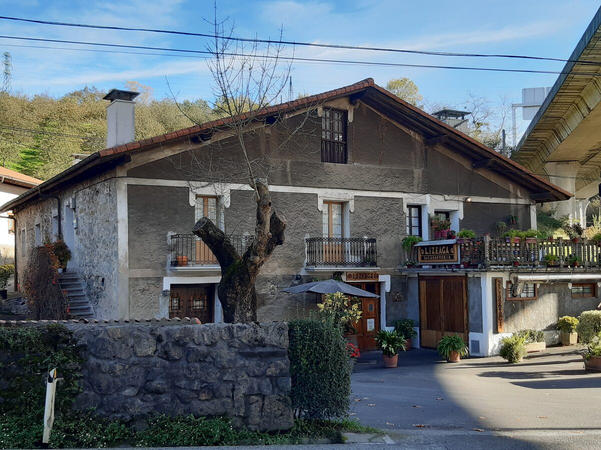Lizeaga, a stone cider house in Astigarraga with a tiled roof and wooden balconies