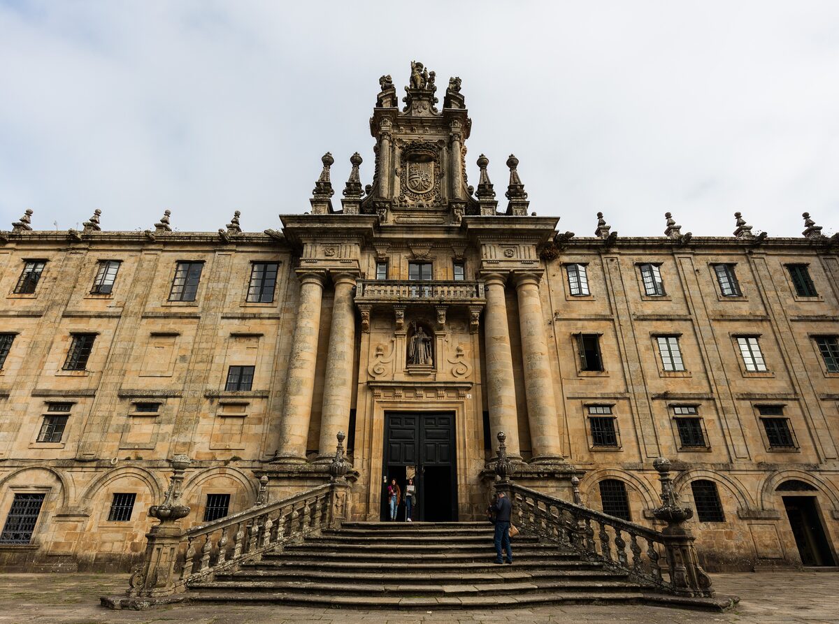 The long Baroque facade of San Martiño Pinario, with its central doorway and stone staircase
