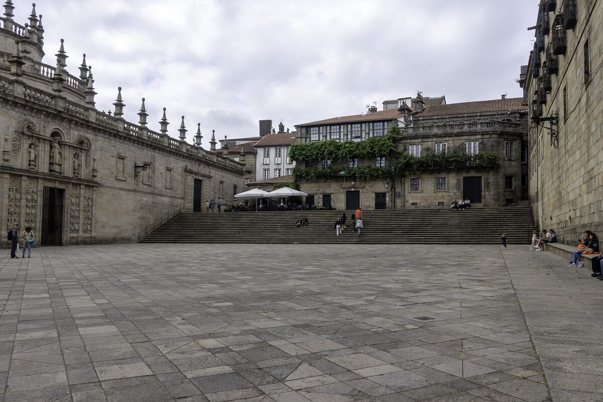 The empty Praza da Quintana, with the cathedral wall on the left and steps up at the far end