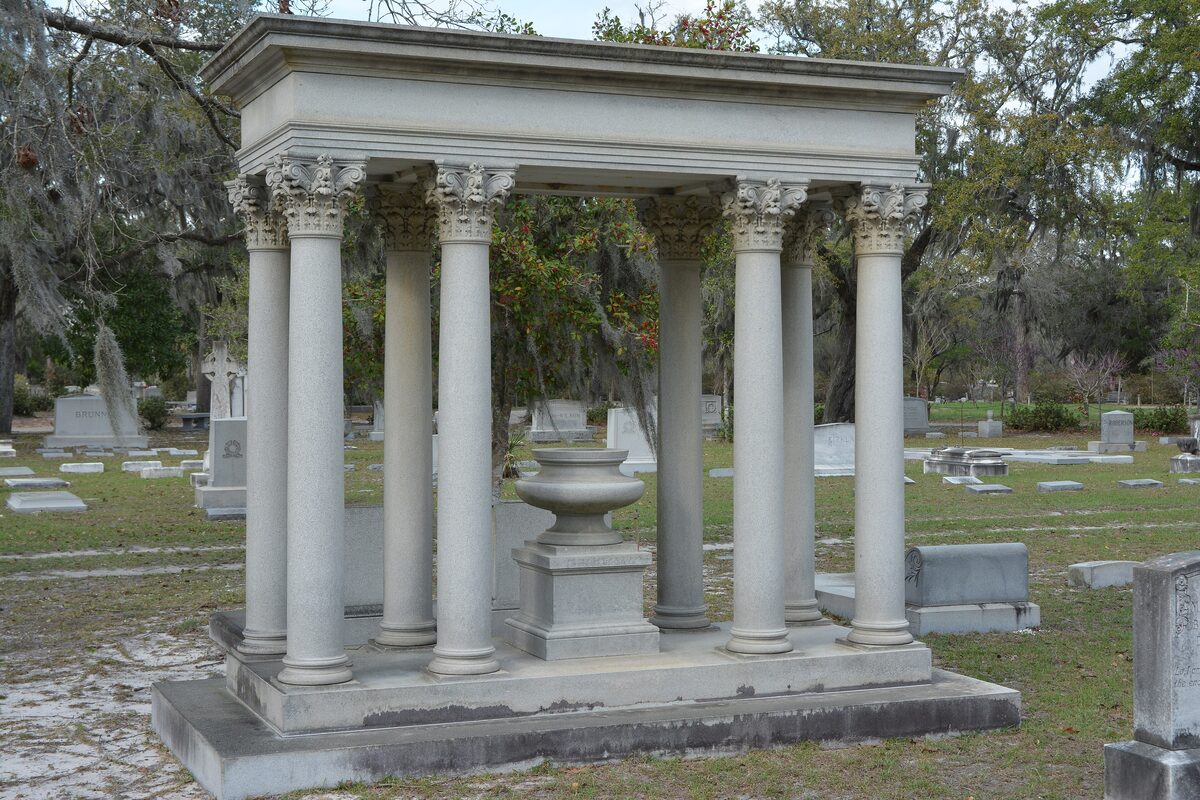Columned marble monument among Spanish moss oaks at Bonaventure Cemetery