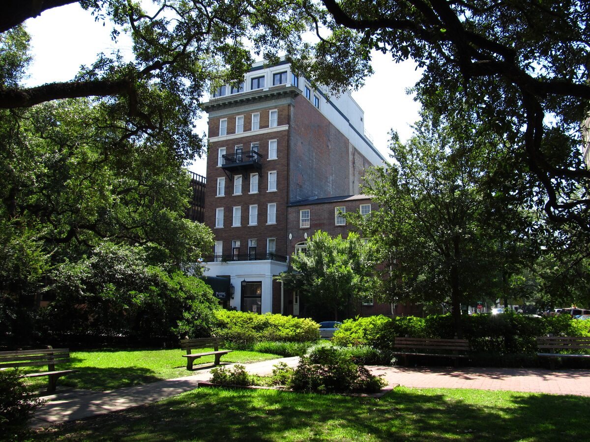 Reynolds Square's lawn and oaks with the Planters Inn behind